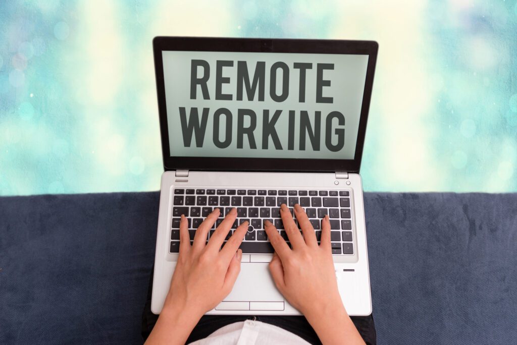 Conceptual hand writing showing Remote Working. Business photo showcasing situation in which an employee works mainly from home.